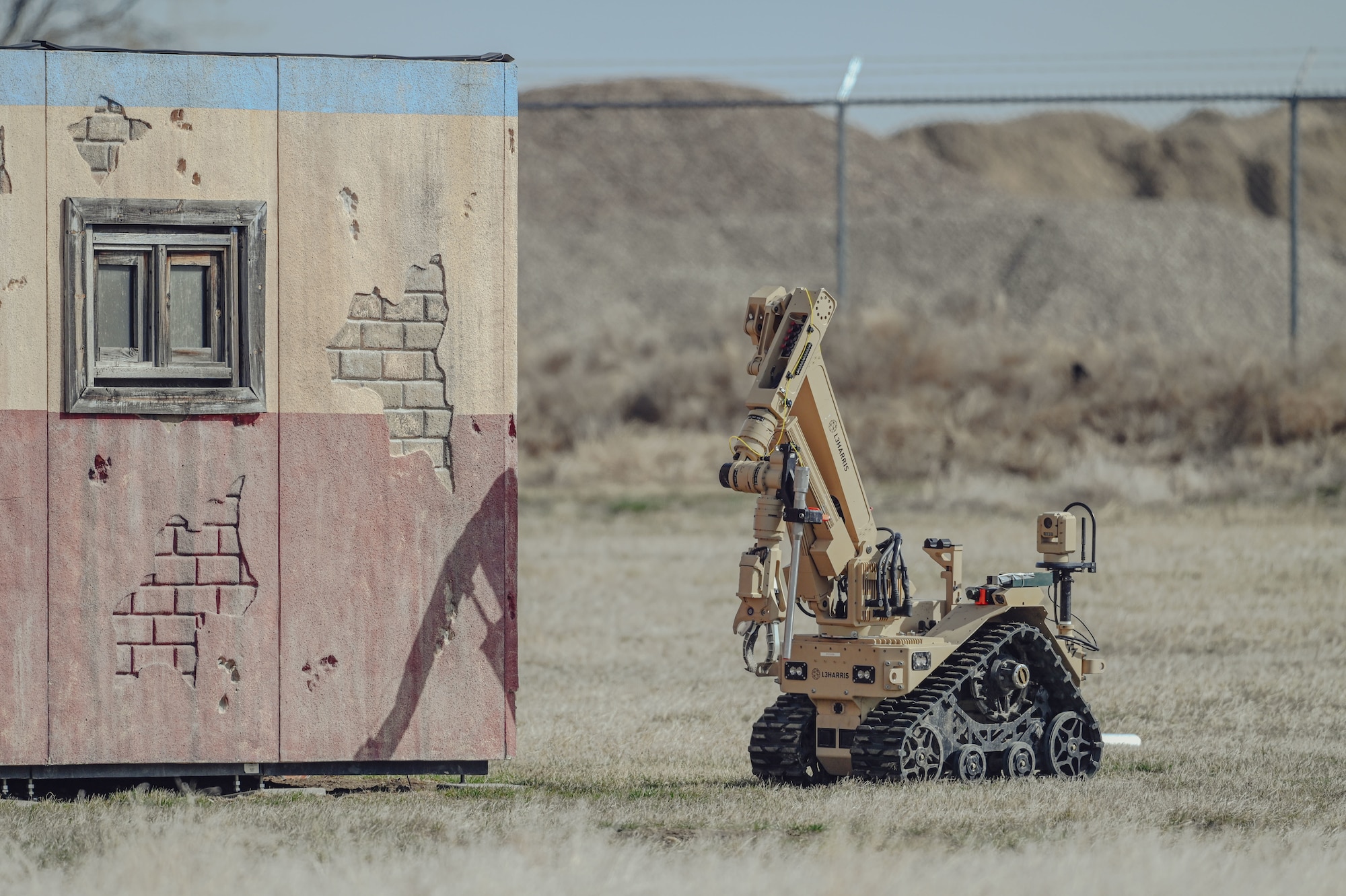 Multi-mission robot system next to a building