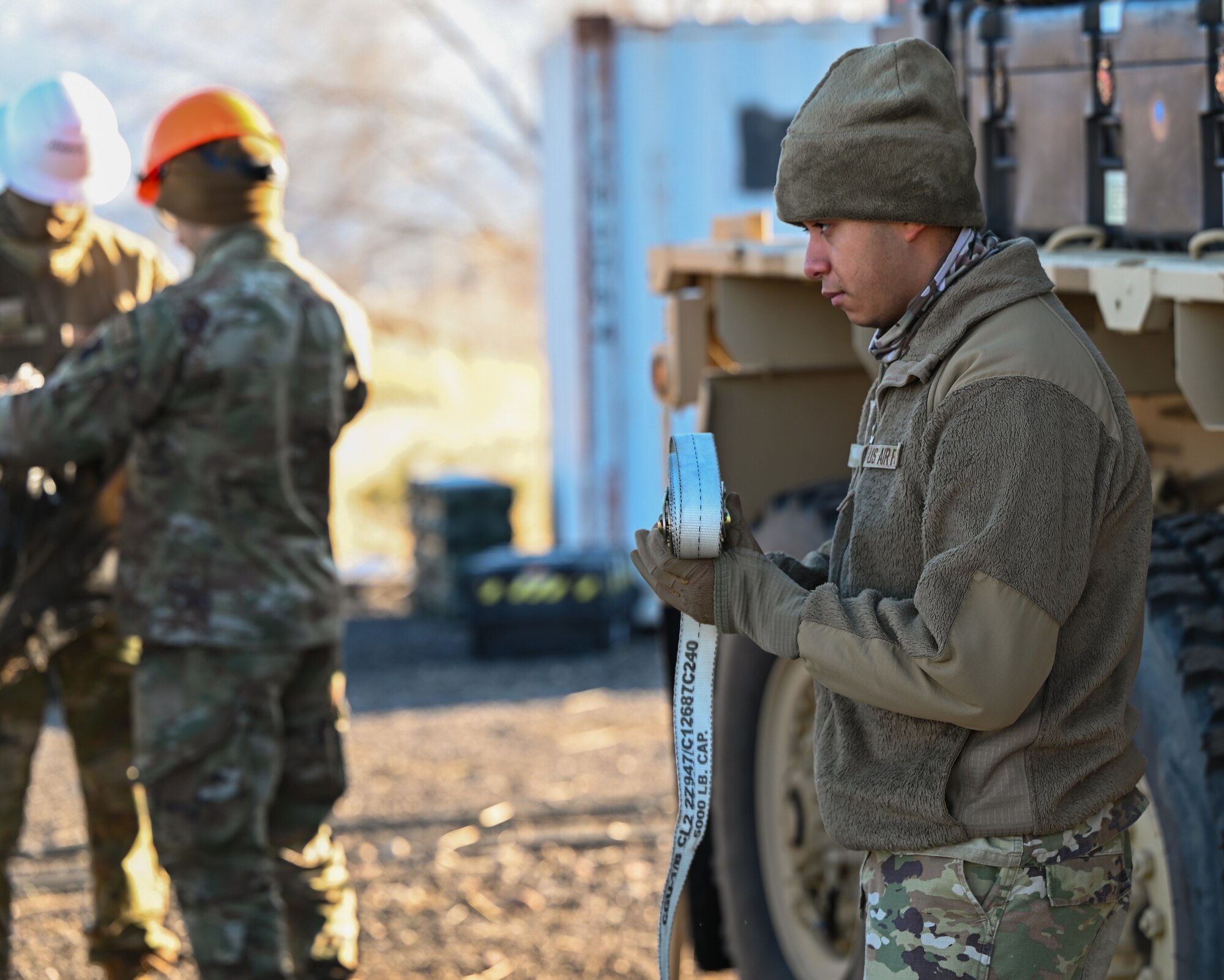 An Airman with the 729th Air Control Squadron reviews equipment strapping procedures during a loadout rehearsal at Hill Air Force Base, Utah, Jan. 13, 2025. These exercises prepare the unit for rapid mobility in contested environments.
(U.S. Air Force photo by Garrett N. Cole)