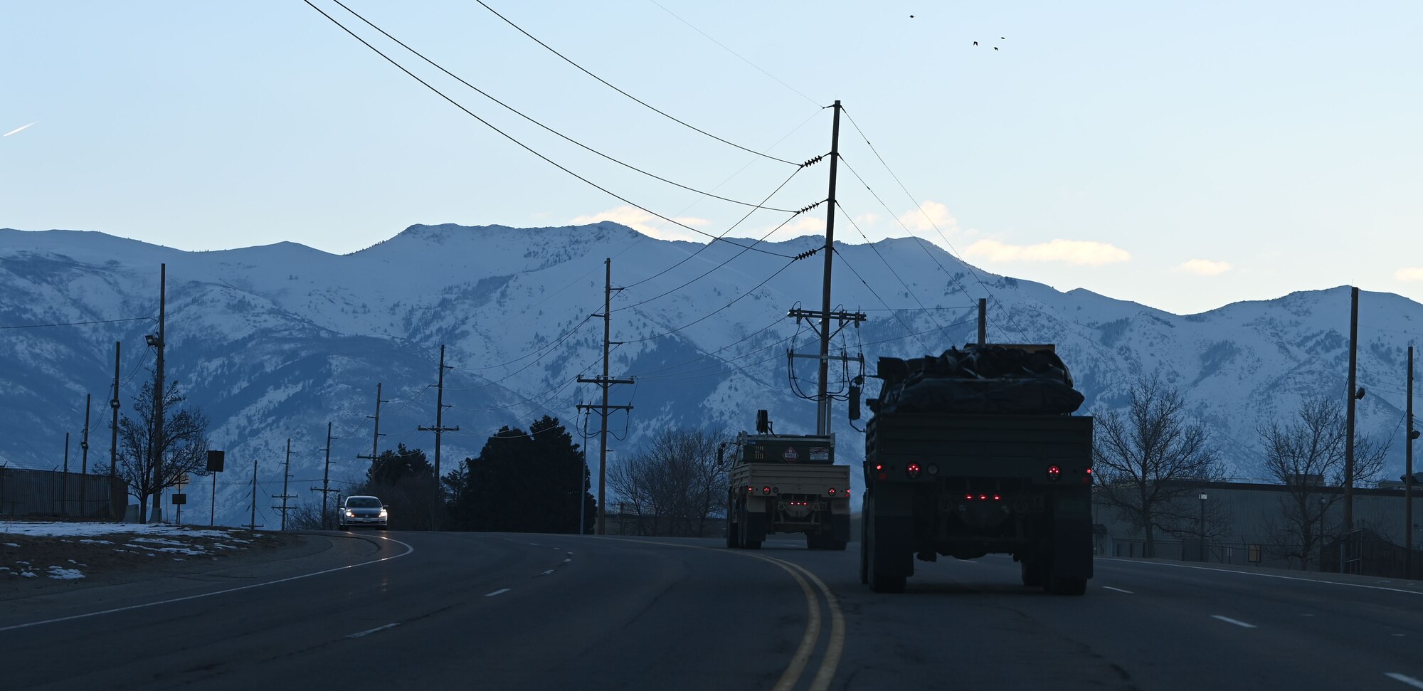 A convoy of vehicles from the 729th Air Control Squadron departs Hill Air Force Base, Utah, Jan. 15, 2025. The movement was part of a training inspection ahead of Red Flag 25-1. (U.S. Air Force photo by Garrett N. Cole)
