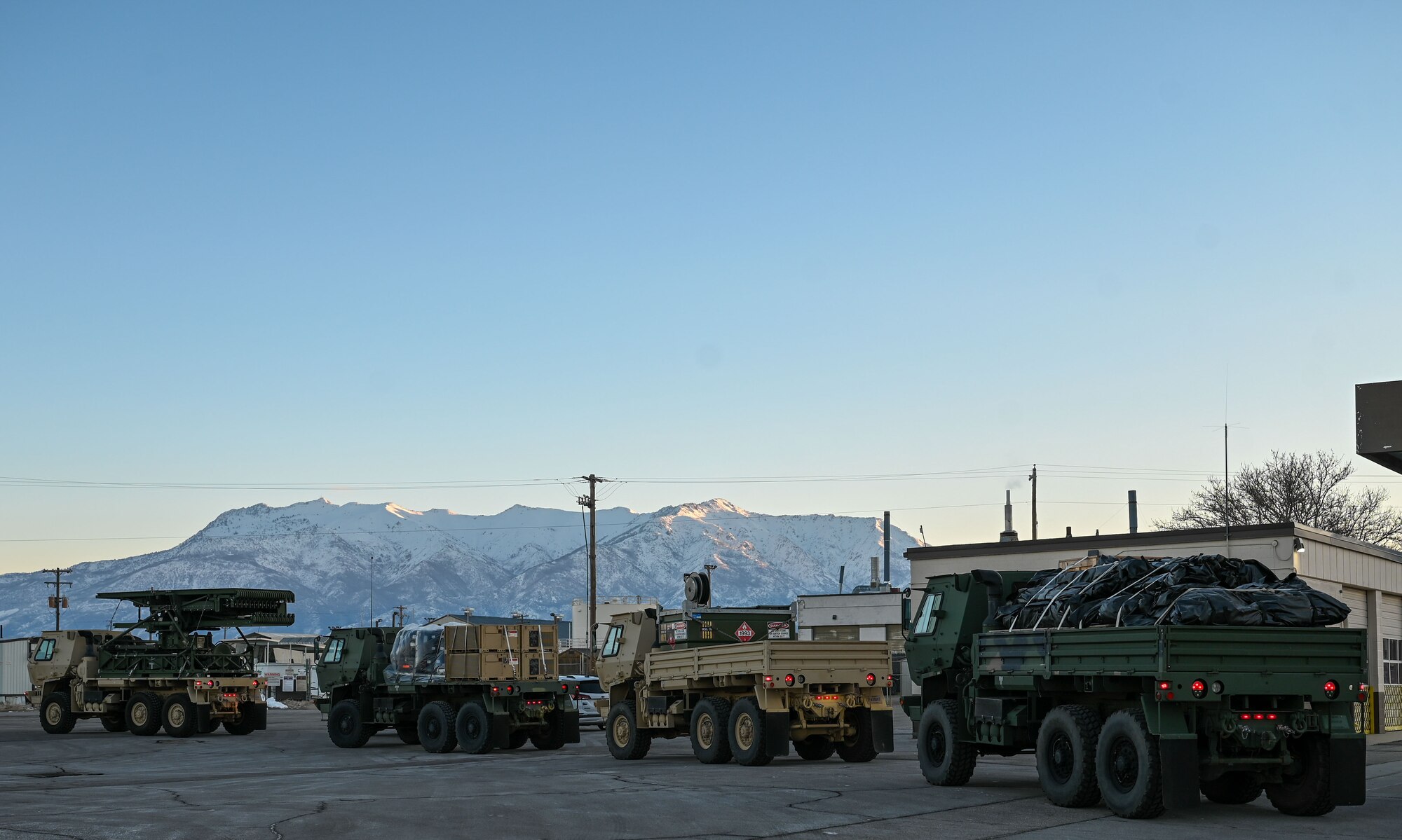 A convoy of vehicles from the 729th Air Control Squadron departs Hill Air Force Base, Utah, Jan. 15, 2025. The movement was part of a training inspection ahead of Red Flag 25-1. (U.S. Air Force photo by Garrett N. Cole)