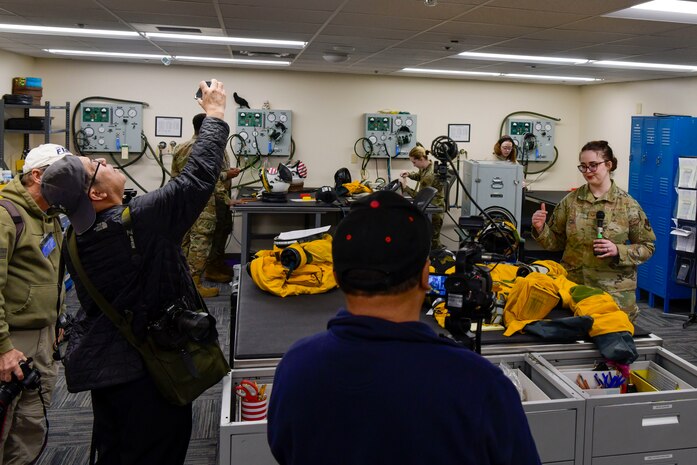 Local media, major news outlets, and aviation influencers receive a pressure suit demonstration during a media day at Beale Air Force Base, California, April 2, 2025.