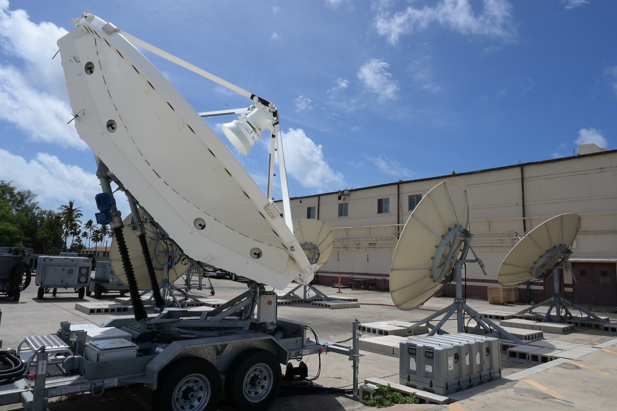 Five antennas on pavement.