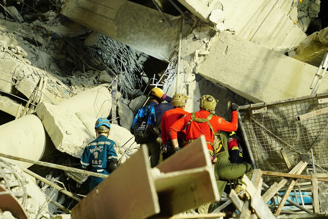 U.S. Indo-Pacific Command military personnel work alongside Thai military and first responders near the collapsed State Audit Office building in Bangkok, which fell after a 7.7 magnitude earthquake affected Thailand and its neighboring countries on March 28, 2025.