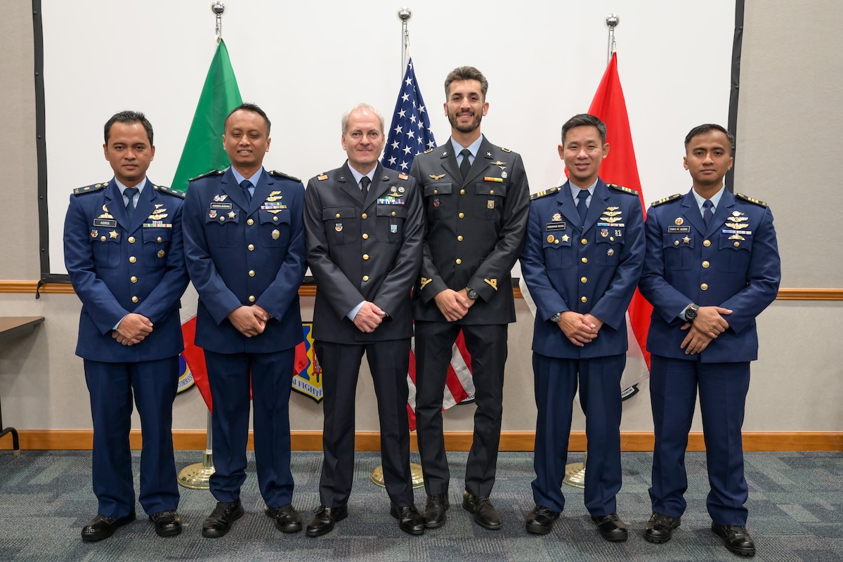 A photo of graduates posing.