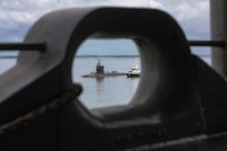 Virginia-class fast-attack submarine USS Minnesota (SSN 783) prepares to moor alongside submarine tender USS Emory S. Land (AS 39) during a scheduled port visit in Darwin, Northern Territory, Australia, March 27, 2025.