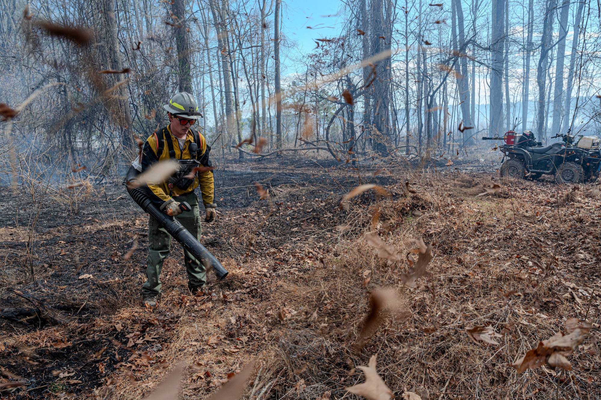 Firefighter uses a leafblower