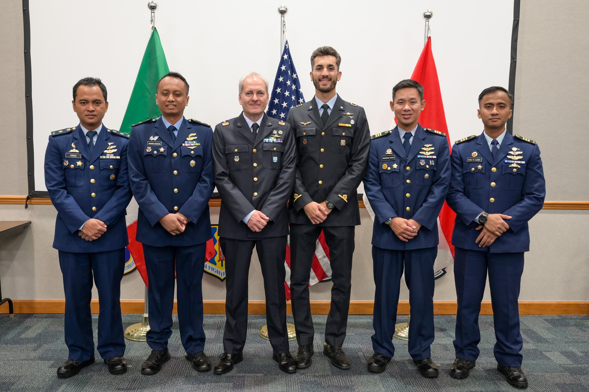 A photo of graduates posing.