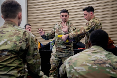 Defenders assigned to the 374 Security Forces Squadron practice security tactics.
