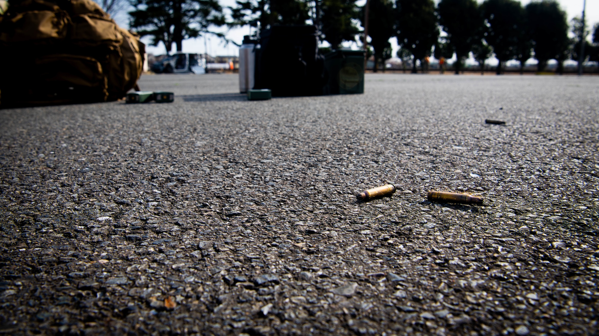 Shell casings scatter the area.