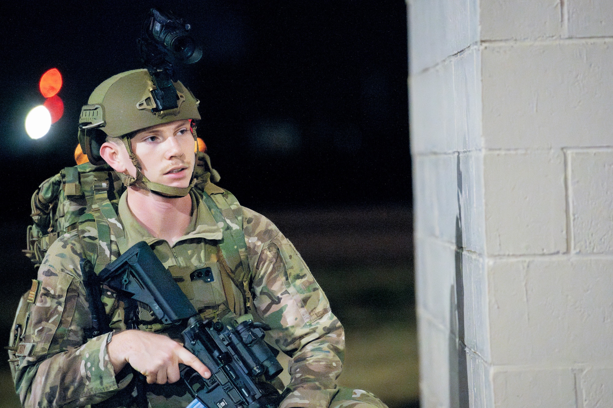 U.S. Air Force Senior Airman Bryan Woody, 374 Security Forces Squadron patrolman, secures a perimeter.