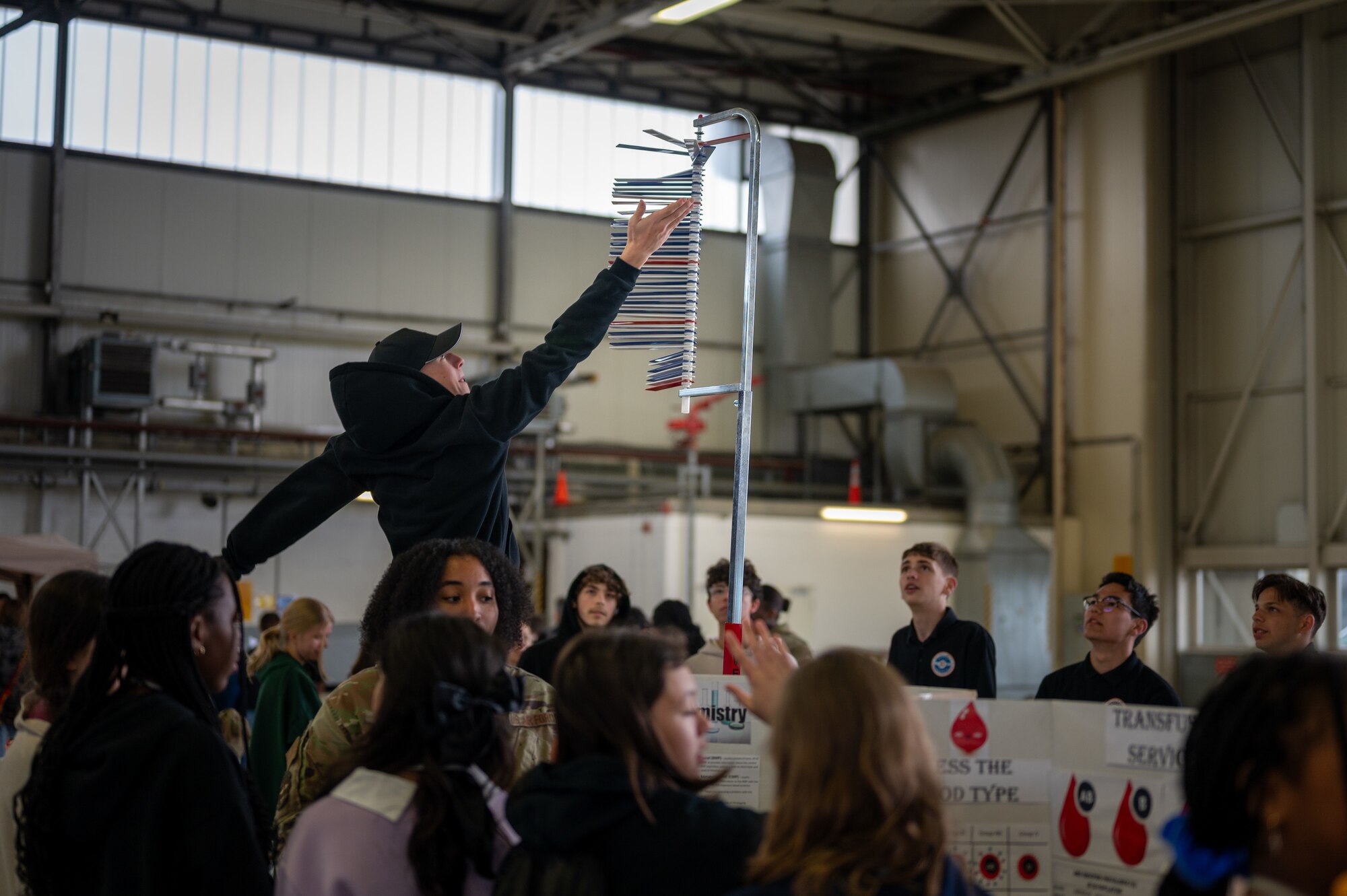 student jumps to measure his vertical jump