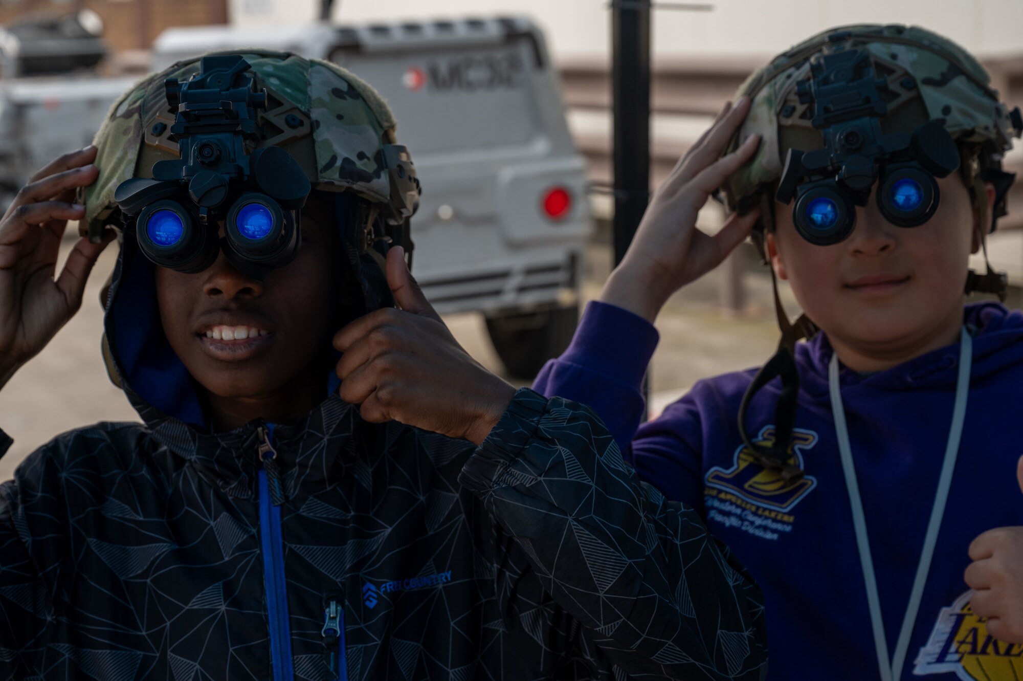 students wear night vision goggles at event
