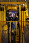 Aviation Machinist’s Mate 2nd Class Eduardo Sanchez, assigned to aviation intermediate maintenance department aboard the world’s largest aircraft carrier, USS Gerald R. Ford (CVN 78), troubleshoots a forklift in the hangar bay, March 31, 2025.