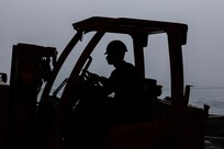 Aviation Machinist’s Mate 2nd Class Donald Stepp, assigned to aviation intermediate maintenance department aboard the world’s largest aircraft carrier, USS Gerald R. Ford (CVN 78), operates a forklift in the hangar bay, March 31, 2025.