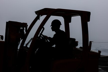 Aviation Machinist’s Mate 2nd Class Donald Stepp, assigned to aviation intermediate maintenance department aboard the world’s largest aircraft carrier, USS Gerald R. Ford (CVN 78), operates a forklift in the hangar bay, March 31, 2025.