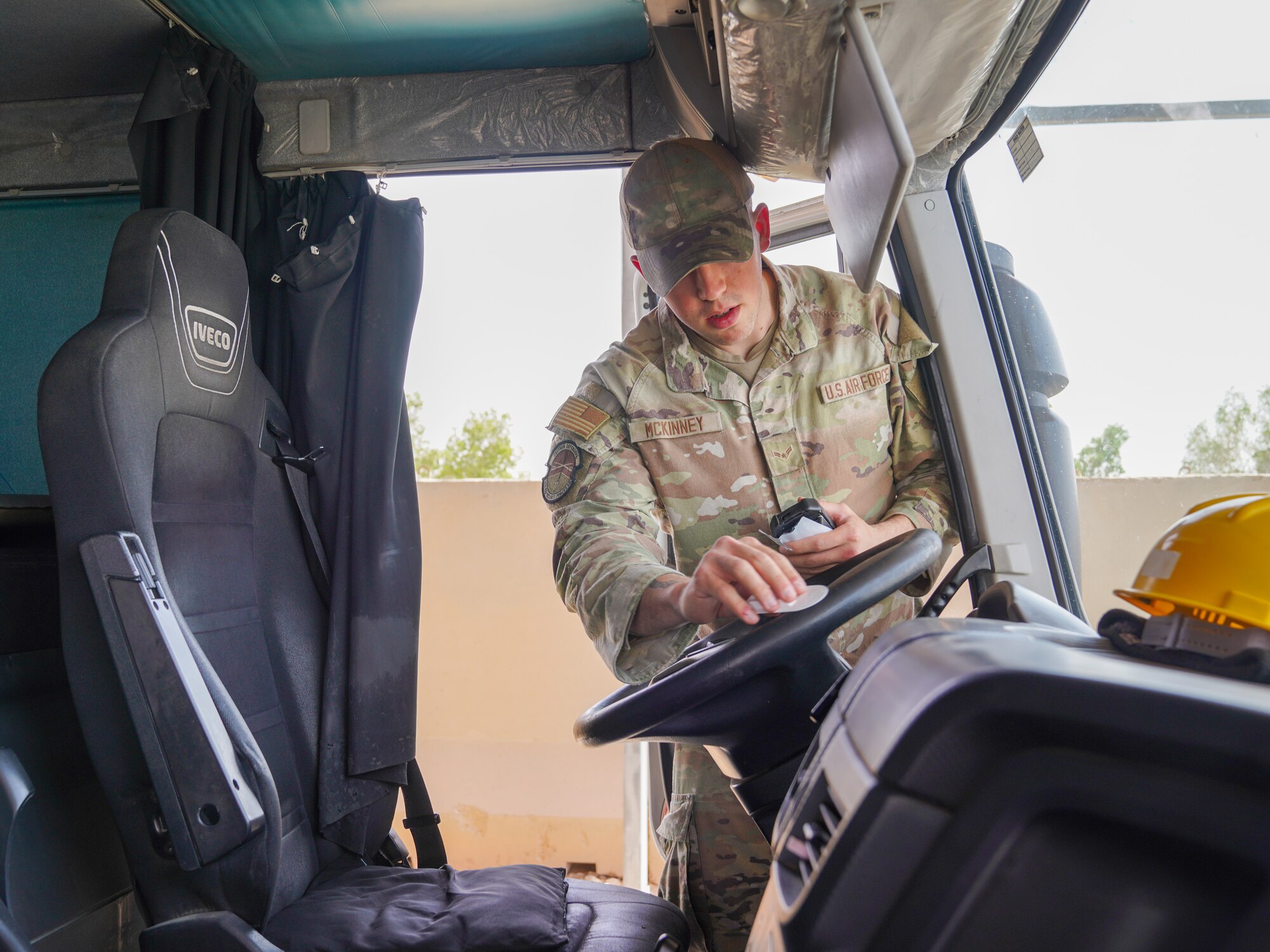 U.S. Air Force Airman 1st Class Carter McKinney, 378th Expeditionary Security Forces Squadron visitor control center member, swabs a steering wheel for bomb-making material residue during a vehicle inspection in the U.S. Central Command area of responsibility, March 31, 2025.