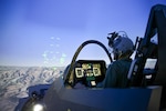 A pilot trains in the Joint Simulation Environment (JSE) at the Naval Air Warfare Center Aircraft Division in Patuxent River, Md.
