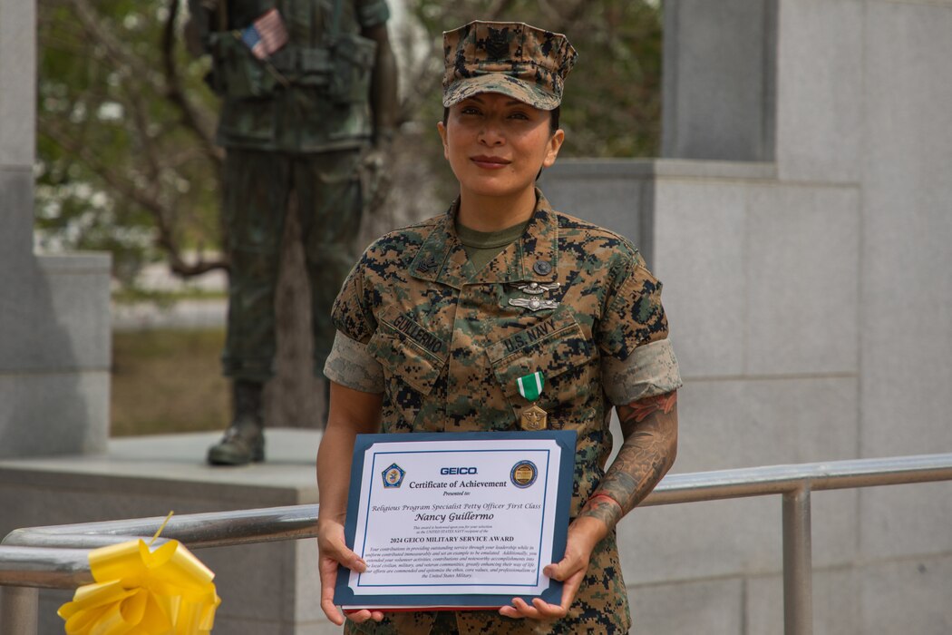 U.S Navy Petty Officer First Class Nancy Guillermo, a Queens, New York native with the 24th Marine Expeditionary Unit (MEU), poses for a portrait after being awarded a Navy Commendation Medal and the 2024 GEICO Military Service Award at the Lejeune Memorial Gardens, Jacksonville, N.C., March 24, 2025. As the 24th MEU’s Religious Programs Specialist, Guillermo organized and participated in multiple volunteer opportunities and community relation events during the pre-deployment training cycle and deployment. (U.S. Marine Corps photo by Cpl. Victoria Hutt)