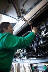 Aviation Machinist’s Mate 2nd Class Leslie Perez, assigned to the “Golden Warriors” of Strike Fighter Squadron (VFA) 87, performs maintenance on a jet engine in the jet engine shop aboard the world’s largest aircraft carrier, USS Gerald R. Ford (CVN 78), March 29, 2025.