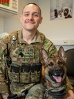 airmen and mwd pose for photo