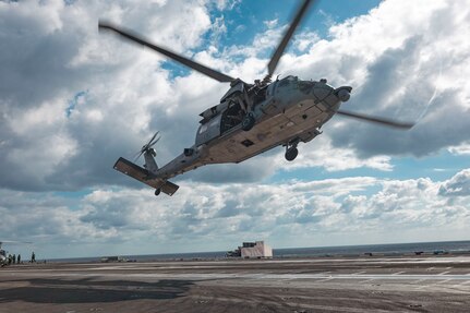 Sailors assigned to Explosive Ordnance Disposal Mobile Unit (EODMU) 12 fast rope from an MH-60S Sea Hawk, attached to the "Tridents" of Helicopter Sea Combat Squadron (HSC) 9, onto the flight deck of the world's largest aircraft carrier, USS Gerald R. Ford (CVN 78), March 28, 2025.