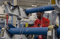 Aviation Ordnanceman 1st Class Ebone Crawford, assigned to weapons department aboard the world’s largest aircraft carrier, USS Gerald R. Ford (CVN 78), inspects training ammo in the weapons transfer area, March 27, 2025.