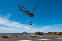 An MH-60S Sea Hawk, attached to the "Tridents" of Helicopter Sea Combat Squadron (HSC) 9, conducts a vertical replenishment (VERTREP) with the world's largest aircraft carrier, USS Gerald R. Ford (CVN 78), March 27, 2025.