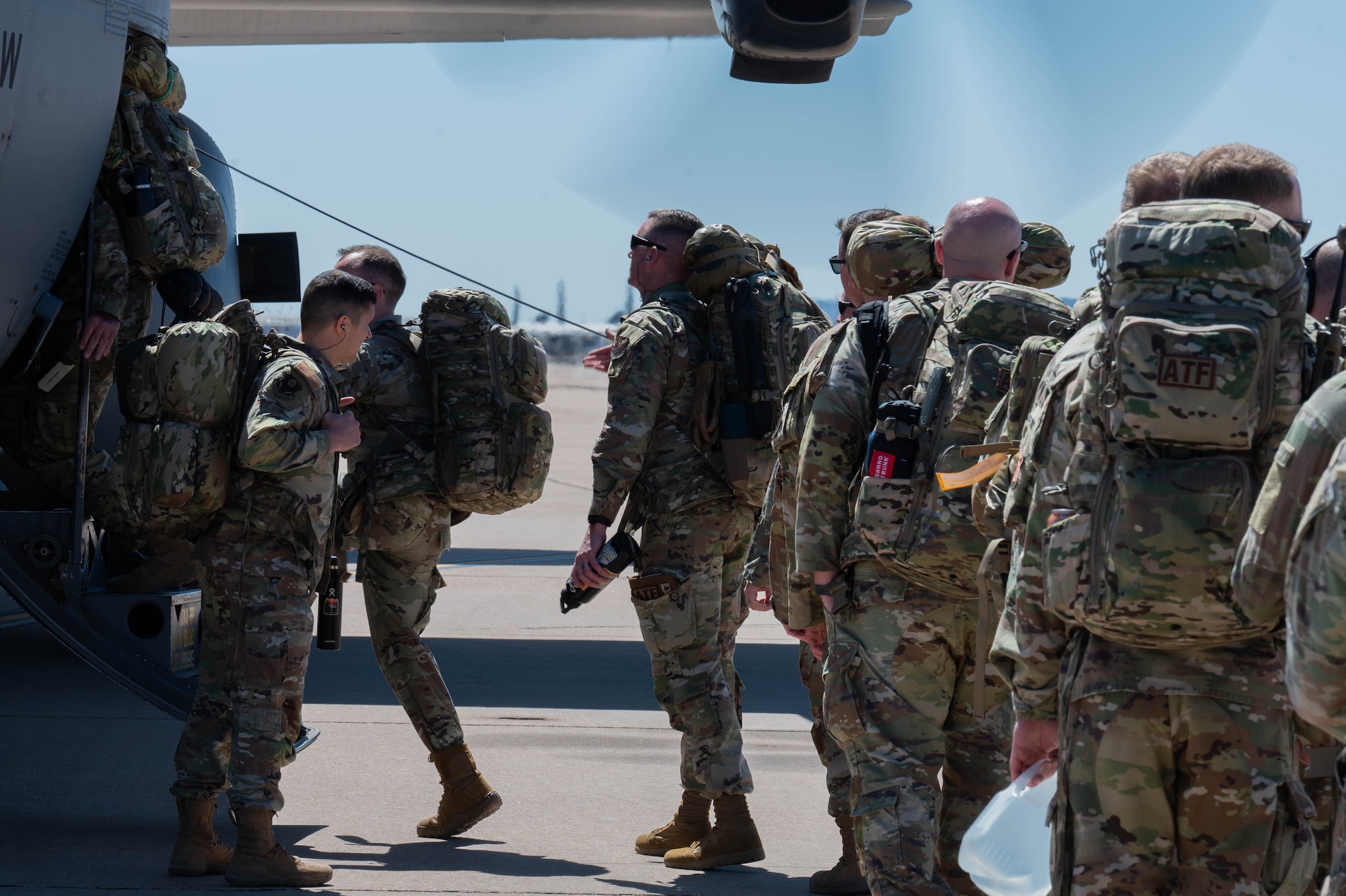 Airmen from the 21st Air Task Force board a C-130J Super Hercules assigned to the 317th Airlift Wing during a field training exercise at Dyess Air Force Base, Texas, March 20, 2025. The 21st ATF and 317th AW leveraged their local partnership to tackle converging priorities. The exercise started with a flight provided by the 317th AW, simulating flying into an austere environment to create a more realistic training scenario. (U.S. Air Force photo by Senior Airman Alondra Cristobal Hernandez)