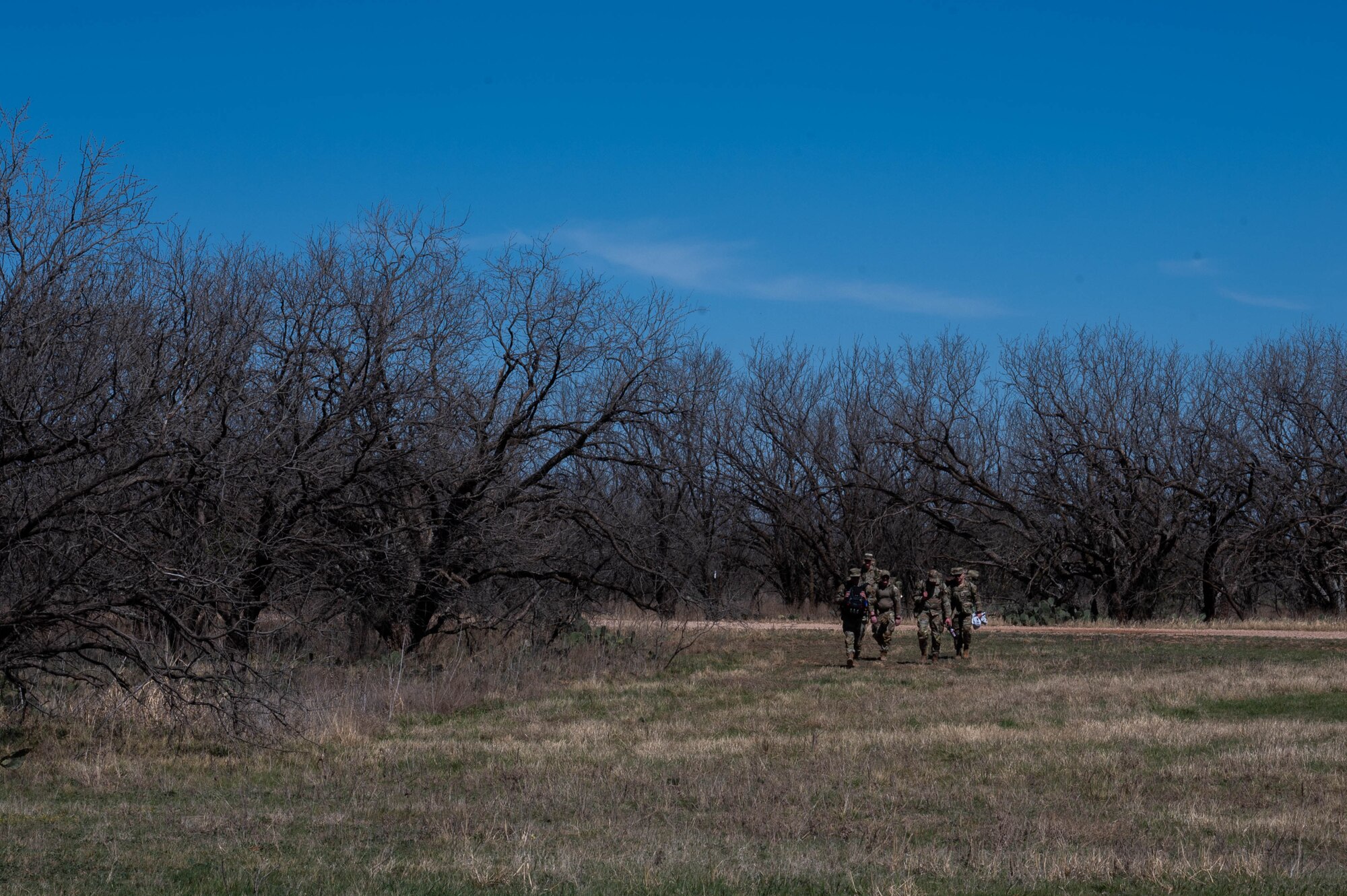 Airmen from the 21st Air Task Force ruck during a field training exercise at Dyess Air Force Base, Texas, March 20, 2025. The overnight training allowed the 21st ATF to exercise command and control elements using an Agile Combat Employment design rather than a traditional beddown, enhancing their flexibility and mobility. (U.S. Air Force photo by Senior Airman Alondra Cristobal Hernandez)