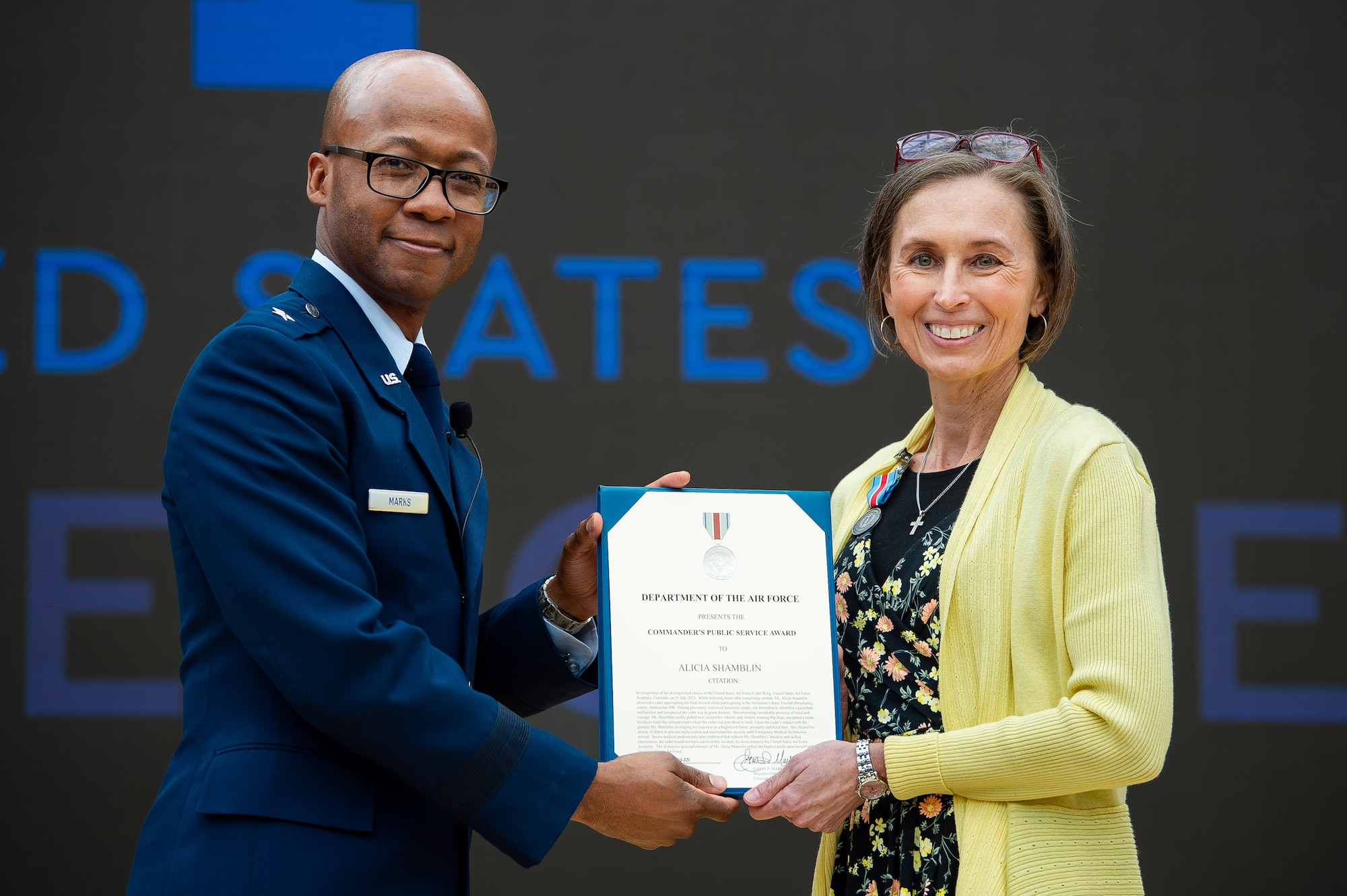 The U.S. Air Force Academy Cadet Wing recognized Mrs. Alicia Shamblin for her extraordinary actions that saved the life of a cadet during an award ceremony at Polaris Hall, March 31, 2025. Shamblin, a registered nurse and military spouse, was recognized for her swift response and medical expertise when she witnessed a parachuting accident on July 31, 2023. (U.S. Air Force photo by Dylan Smith)