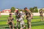 U.S. Army soldiers, assigned to Task Force Associator, work with members from the Djiboutian Coast Guard to preform squad movement and battle drills during Bull Shark 25-1 at Garde-Côtes Djiboutienne GCD, Djibouti, Nov. 4, 2024.  Bull shark is designed to conduct training and knowledge exchanges with our foreign partners. by Staff Sgt. Ivan Mendez- Roman)