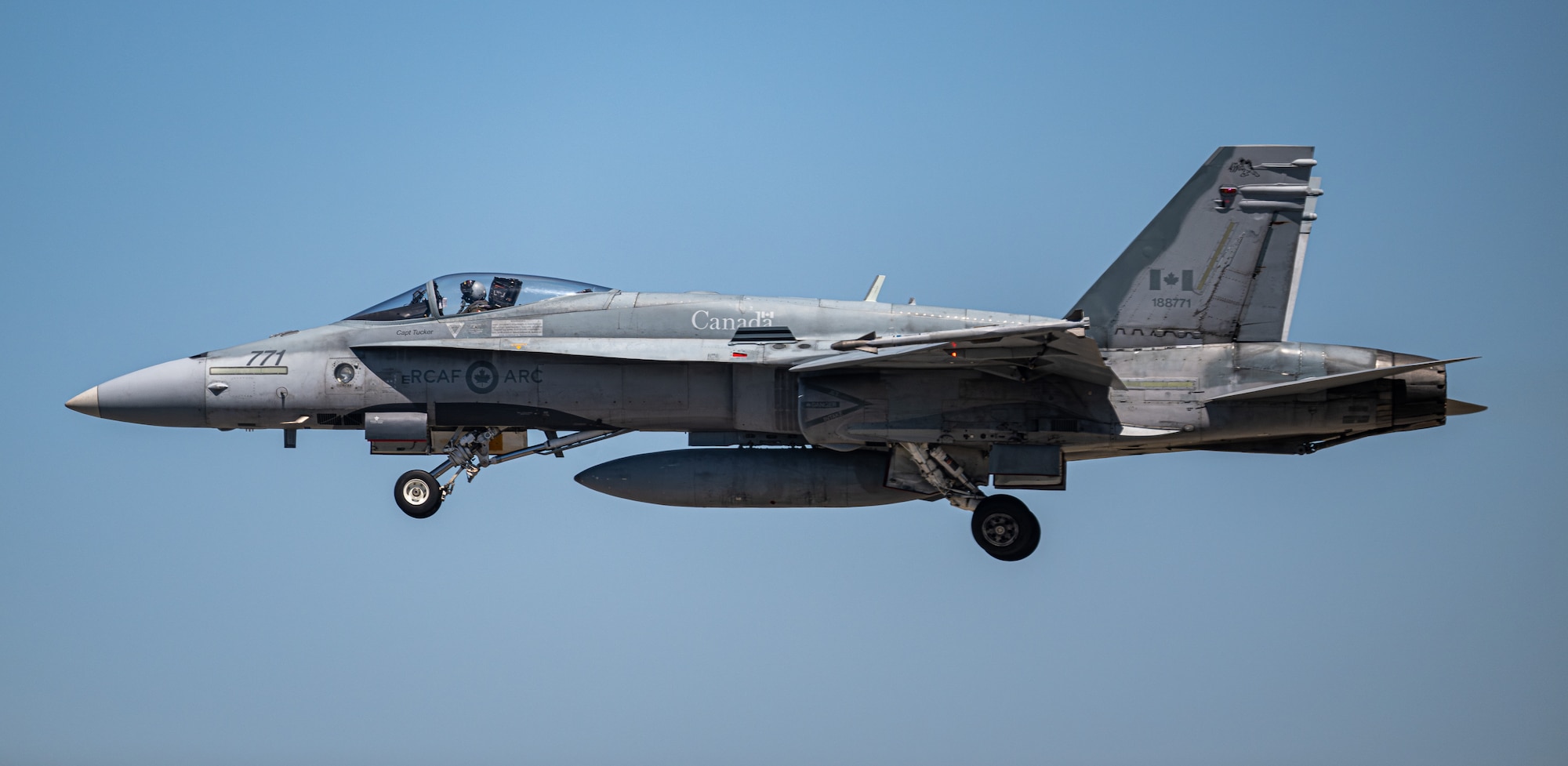 An aircraft flies overhead