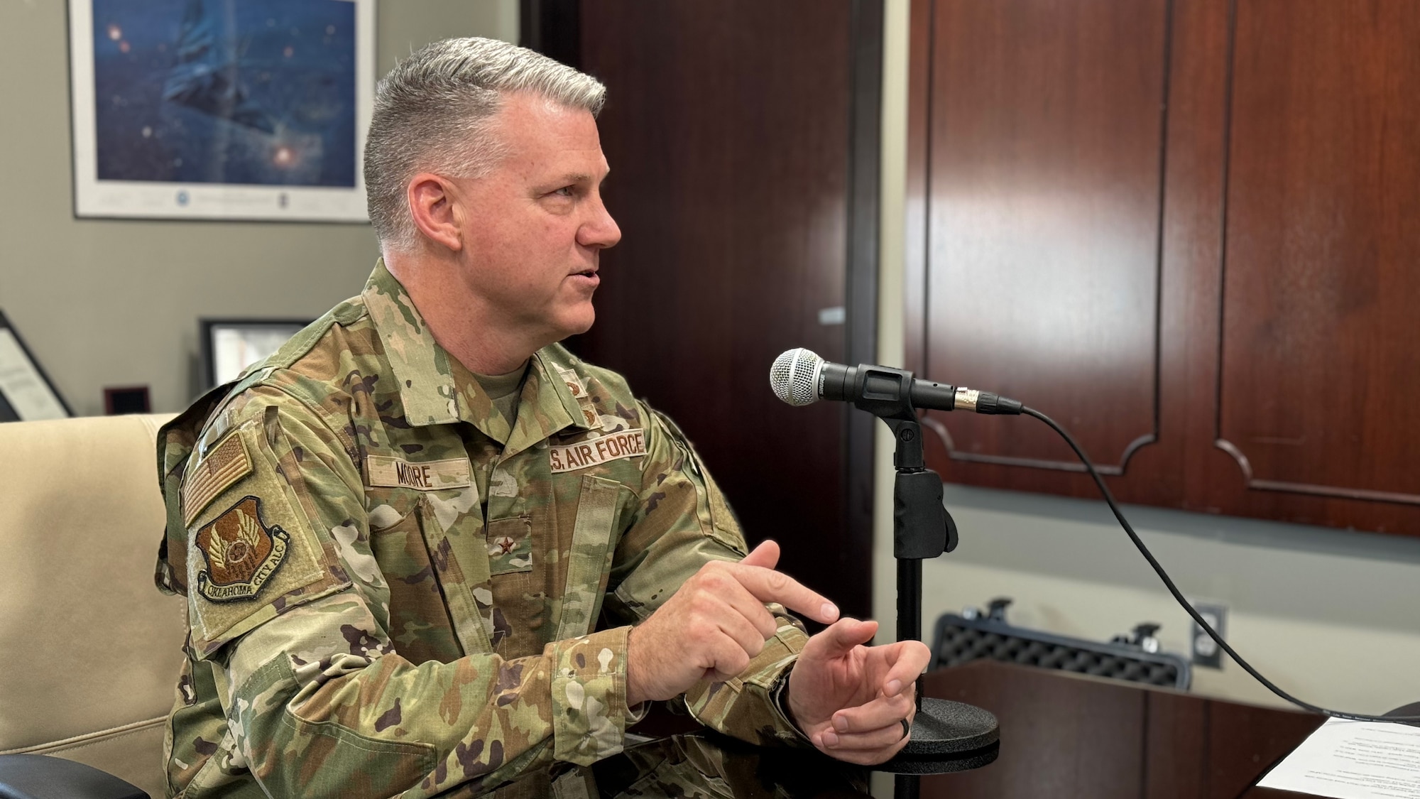 A man speaking into a microphone