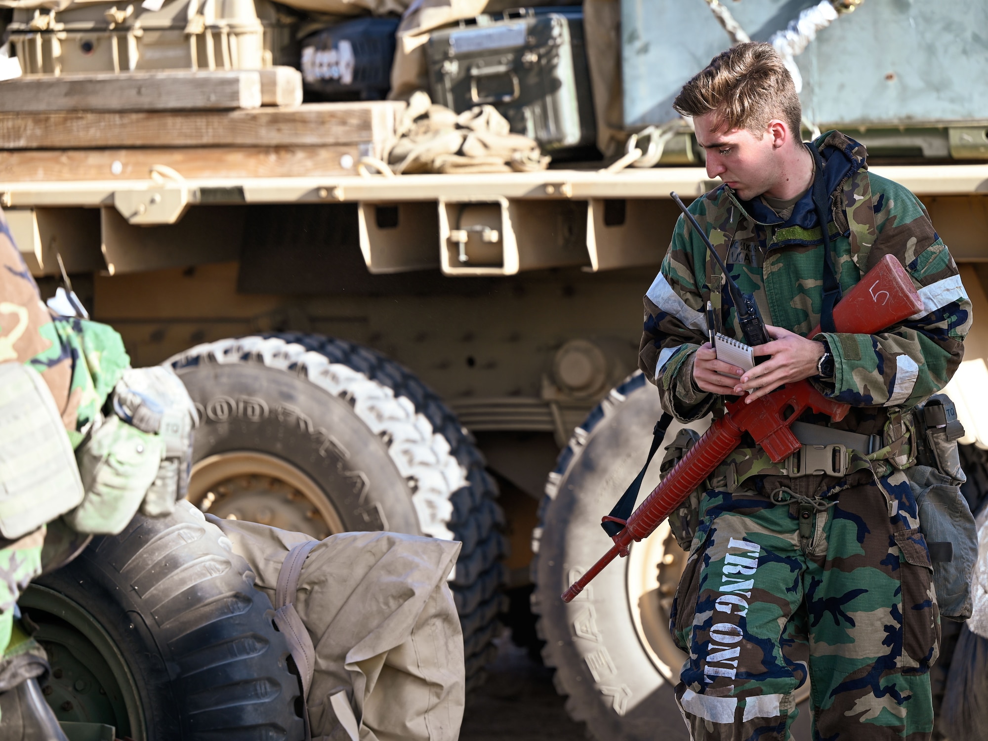 Airmen assigned to the 729th Air Control Squadron conduct readiness checks during simulated chemical warfare training at the Nevada Test and Training Range, Feb. 4, 2025.