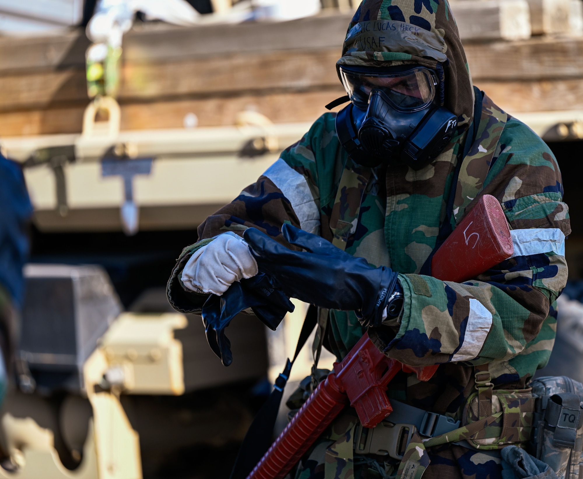 A 729th Air Control Squadron member communicates during a defensive drill while holding a red training rifle. The exercise took place Feb. 4, 2025, at the Nevada Test and Training Range.
(U.S. Air Force photo by Garrett N. Cole)