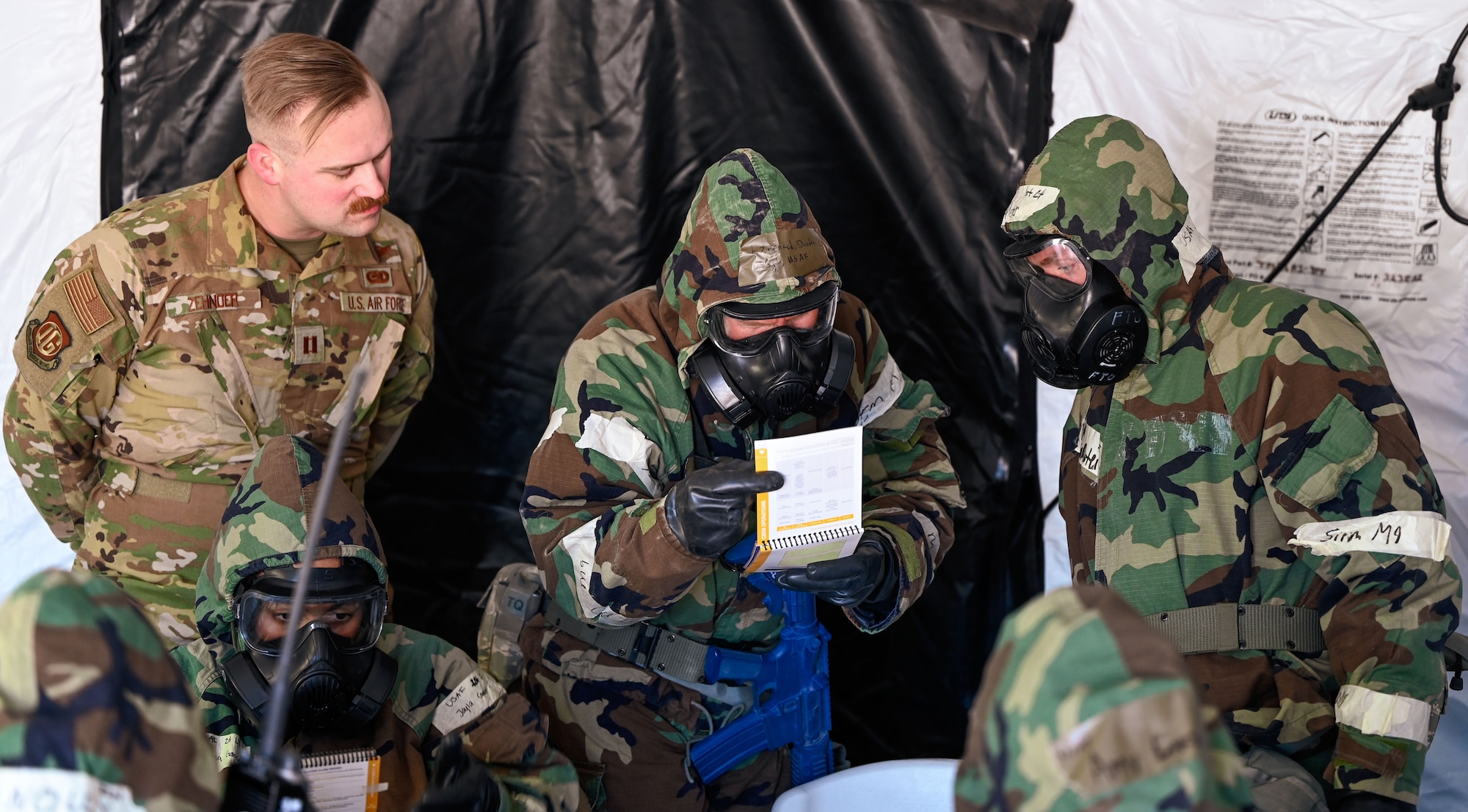 Capt. John Zehnder, chief of exercises for the 552nd Inspector General's office, observes chemical identification procedures during Exercise Bamboo Eagle at the Nevada Test and Training Range, Feb. 4, 2025. The operation occurred during Exercise Bamboo Eagle at the Nevada Test and Training Range, Feb. 4, 2025.
(U.S. Air Force photo by Garrett N. Cole)