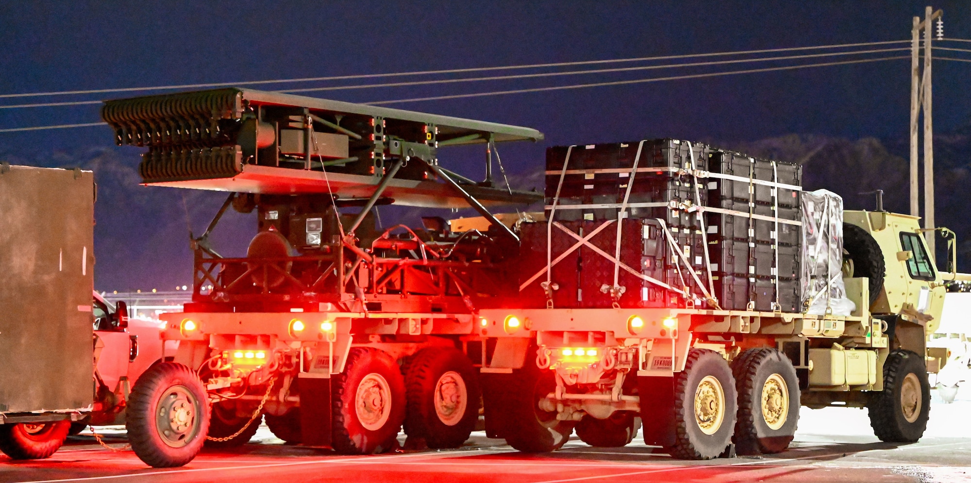 A radar antenna and equipment crates are secured for transport during a pre-dawn convoy at Hill Air Force Base, Utah, Jan. 9, 2025. The 729th Air Control Squadron participated in Exercise Bamboo Eagle to test deployment capabilities.
(U.S. Air Force photo by Garrett N. Cole)