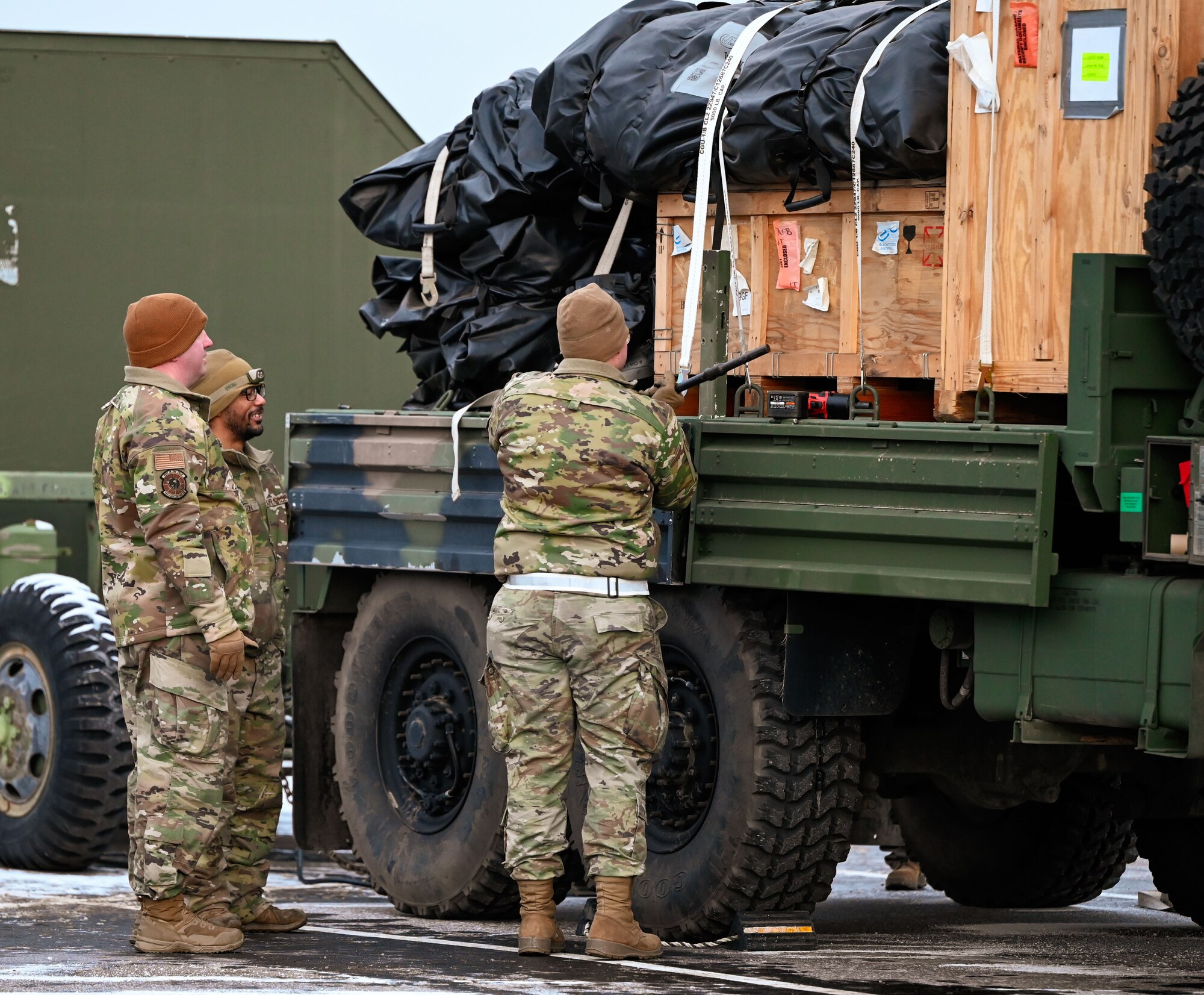 Airmen assigned to the 729th Air Control Squadron secure equipment on a transport vehicle during convoy operations for Exercise Bamboo Eagle at Hill Air Force Base, Utah, Jan. 9, 2025. The early-morning movement tested unit readiness and logistical coordination.
(U.S. Air Force photo by Garrett N. Cole)