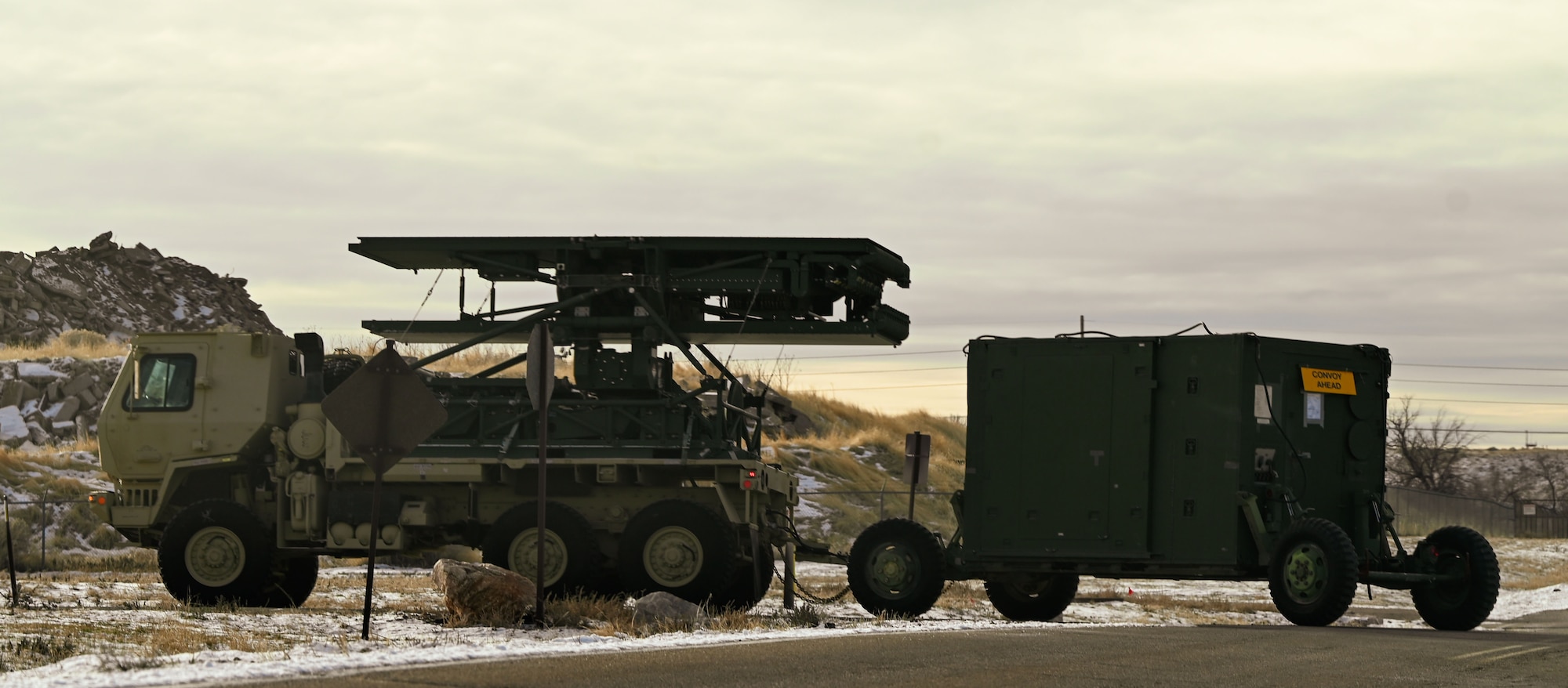A convoy of radar and communications vehicles departs Hill Air Force Base, Utah, en route to Nellis Air Force Base, Nevada, for Red Flag 25-1. The large-scale exercise provides joint and coalition forces with realistic air combat training in a contested, degraded environment.
(U.S. Air Force photo by Garrett N. Cole)