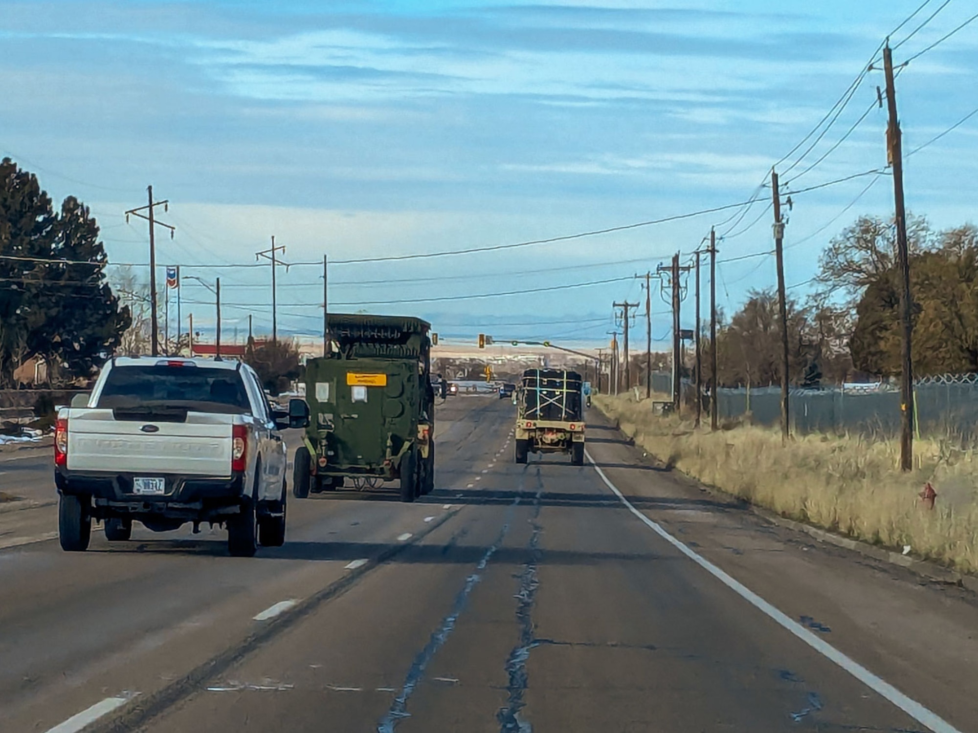A convoy of radar and communications vehicles departs Hill Air Force Base, Utah, en route to Nellis Air Force Base, Nevada, for Red Flag 25-1. The large-scale exercise provides joint and coalition forces with realistic air combat training in a contested, degraded environment.
(U.S. Air Force photo by Garrett N. Cole)
