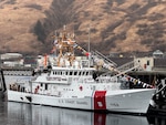 The Coast Guard Cutter John Witherspoon (WPC 1158) crew displays signal flags during the cutter's commissioning ceremony at Coast Guard Base Kodiak, Alaska, April 3, 2025. The commissioning marked the first of three fast response cutters scheduled to homeport in Alaska and was presided over by Rear Adm. Megan Dean, commander of the Seventeenth Coast Guard District.