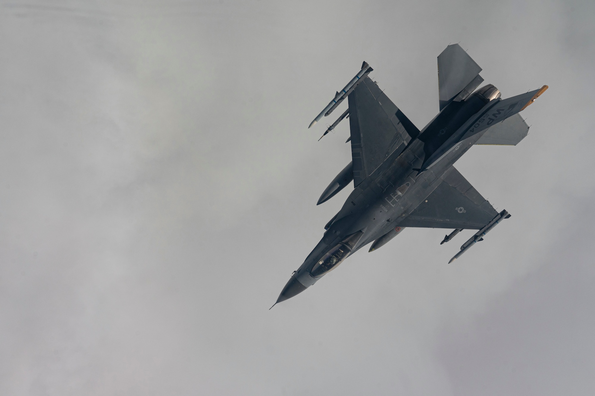 An F-16 Fighting Falcon aircraft assigned to the 80th Fighter Squadron flies over the Korean Peninsula.