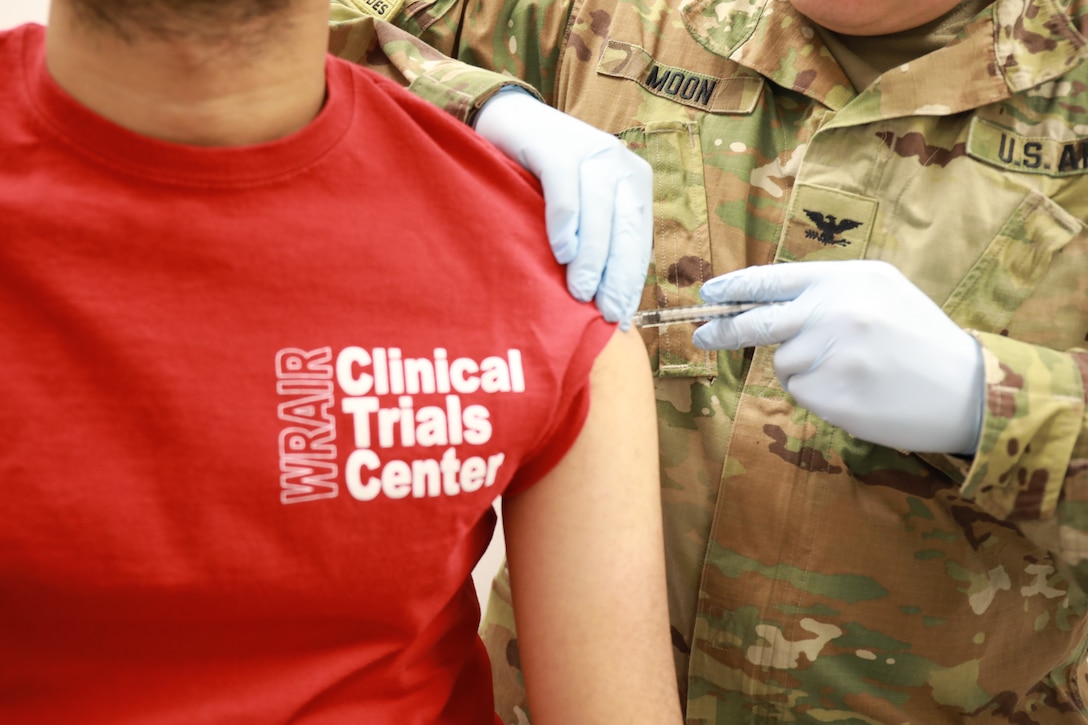 Man receives a shot at WRAIR's Clinical Trials Center