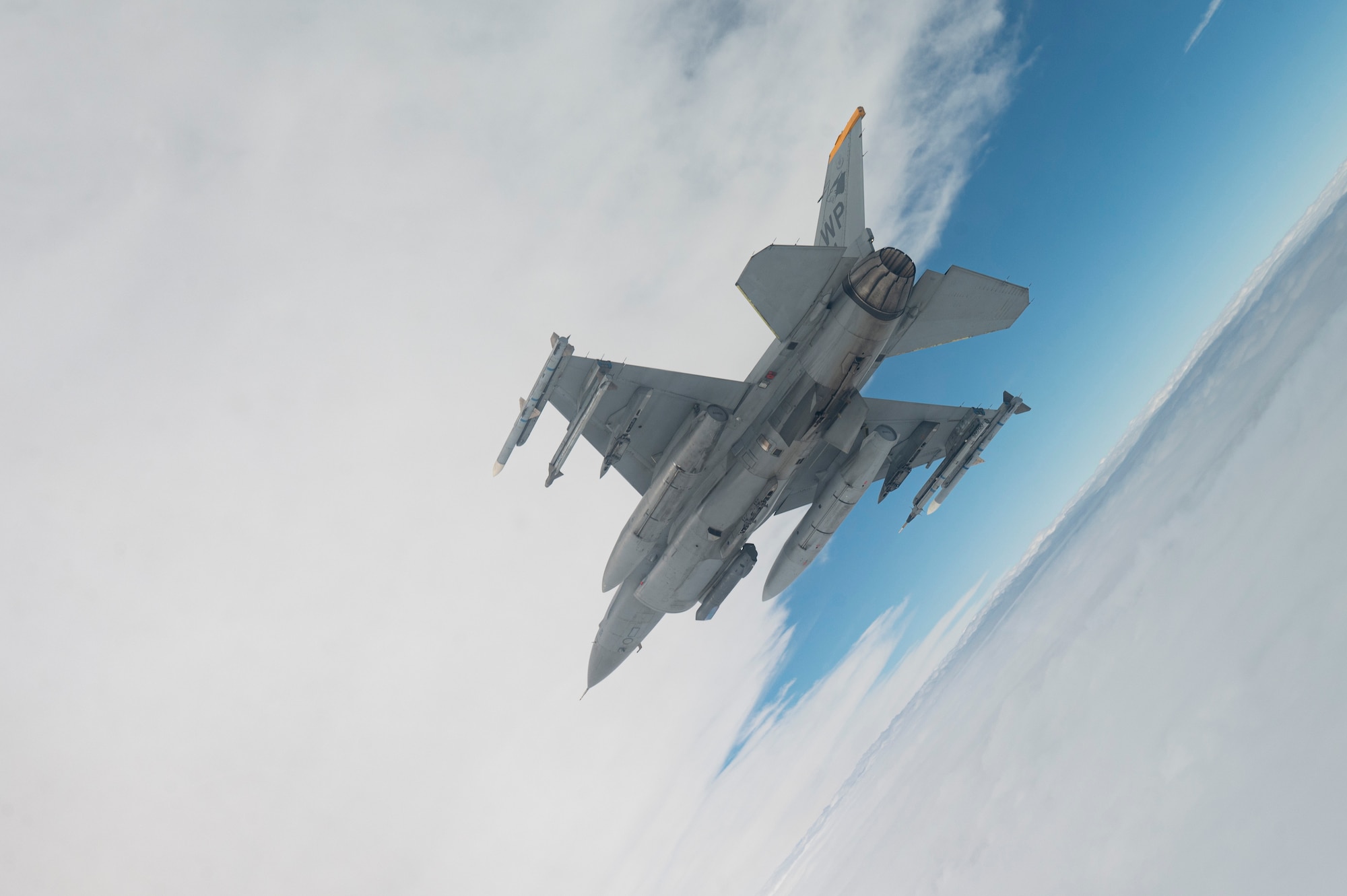 An F-16 Fighting Falcon aircraft assigned to the 80th Fighter Squadron flies over the Korean Peninsula.