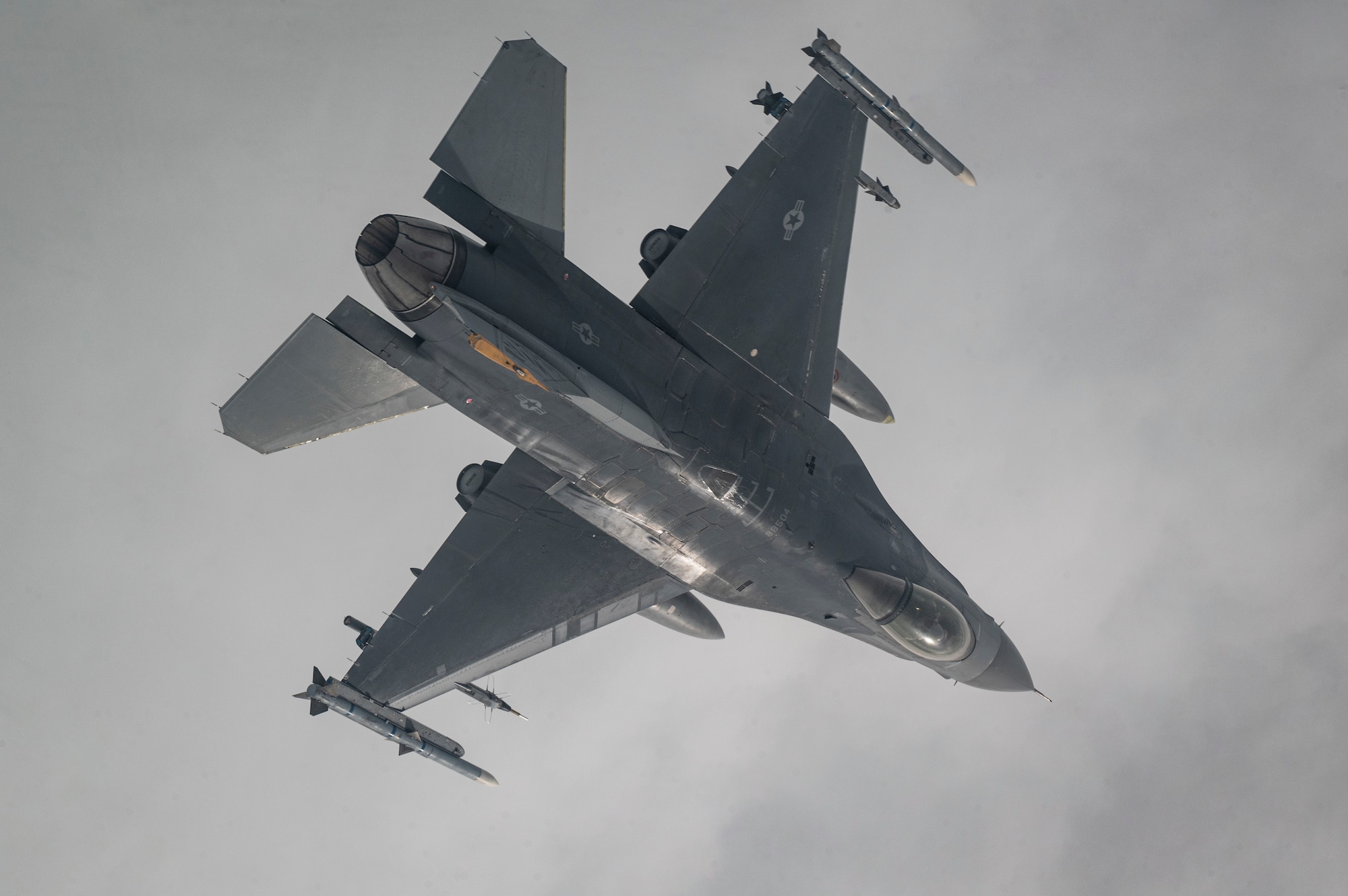 An F-16 Fighting Falcon aircraft assigned to the 80th Fighter Squadron flies over the Korean Peninsula.