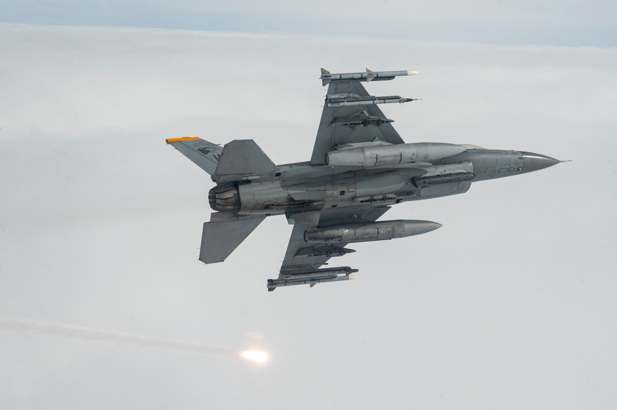 An F-16 Fighting Falcon aircraft assigned to the 80th Fighter Squadron releases flares while flying over the Korean Peninsula.