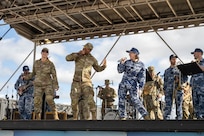 The U.S. Air Force Band of the Pacific and Royal Australian Air Force band perform together at Avalon Australian International Airshow at Avalon Airport at Avalon Airport, Australia, March 29, 2025.