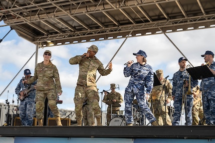 The U.S. Air Force Band of the Pacific and Royal Australian Air Force band perform together at Avalon Australian International Airshow at Avalon Airport at Avalon Airport, Australia, March 29, 2025.