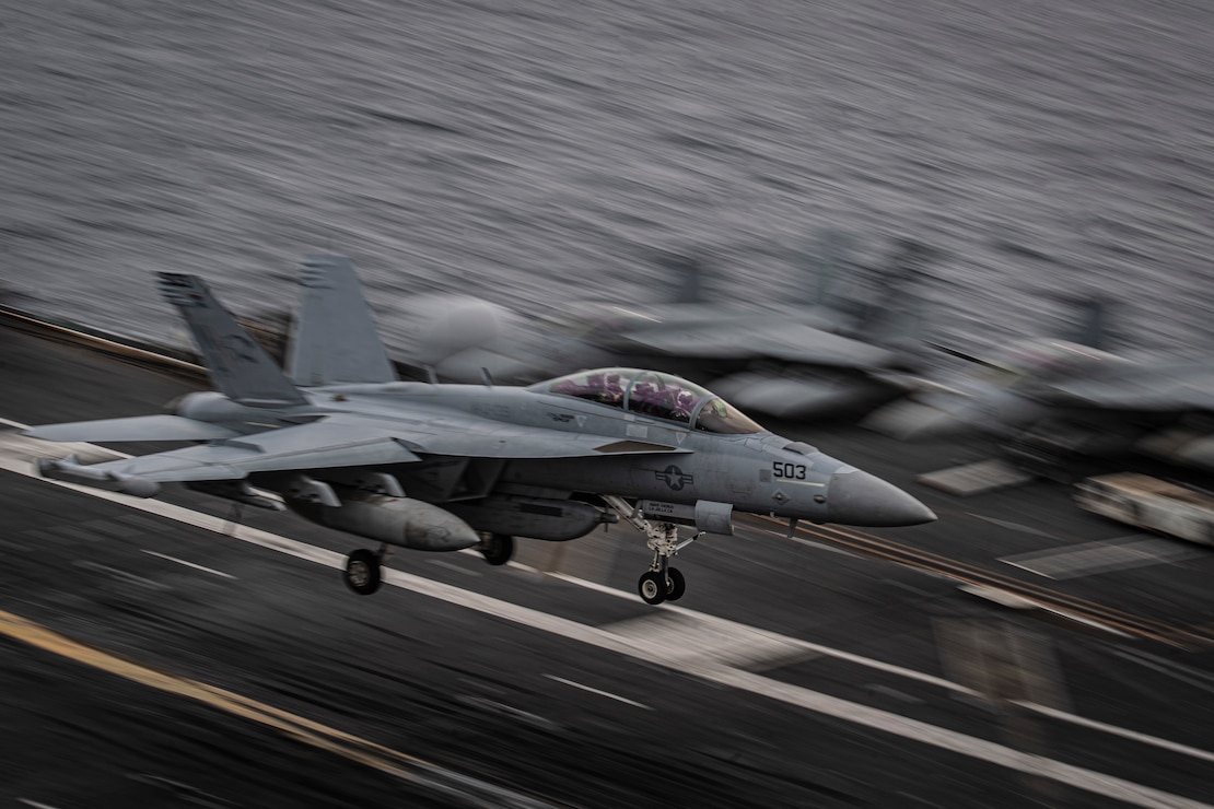 An E/A-18G Growler from the “Cougars” of Electronic Attack Squadron (VAQ) 139 prepares to make an arrested landing on the flight deck of the aircraft carrier USS Nimitz (CVN 68) in the Pacific Ocean, March 28, 2025.