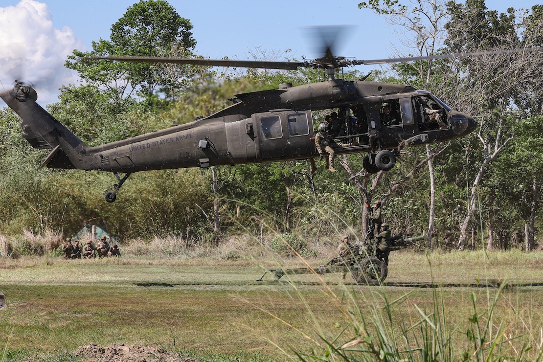 Soldiers of the Philippine Army 5th and 7th Infantry Division and U.S. Army Soldiers assigned to 2nd Battalion, 11th Artillery Regiment, 25th Division Artillery, 25th Infantry Division, conduct joint Sling Load training during Salaknib 2025, Fort Magsaysay, Philippines, March 26, 2025.
